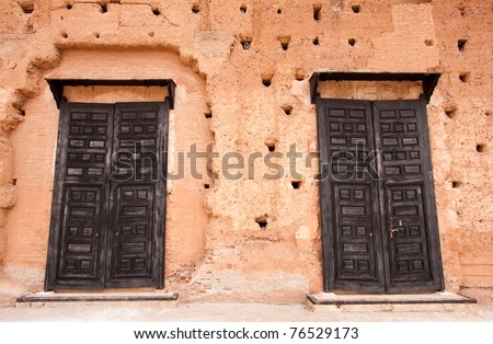 Old ruins wall with sealed doors, Moroccan style