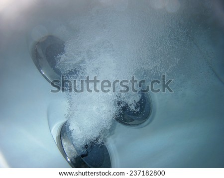 Hot tub jets under water with bubles