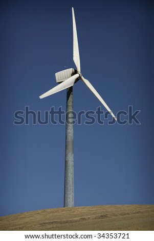 Windmill on a hill to generate electricity
