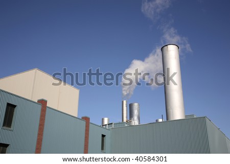 smoking chimney on an industrial building