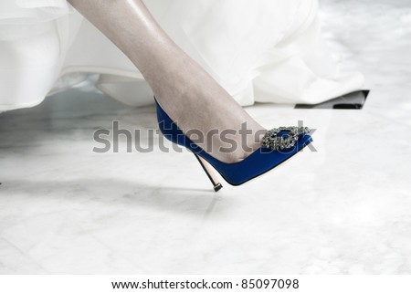 stock photo Blue Bridal Shoe on the Foot of a Bride