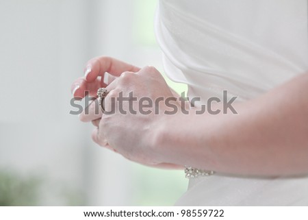 Young Woman tries on her wedding ring