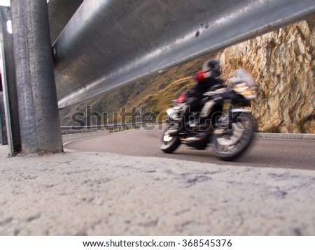 rapid motorcyclists from the roadside with guardrail
