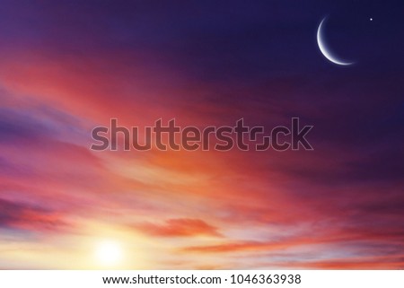 Sunset or sunrise with clouds . Red sunset and moon .  beautiful sky  . Prayer time . Generous Ramadan . Mubarak background .