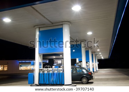 Blue filling station at night