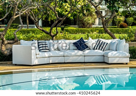 Outdoor indoor sofa with water resistant pillows