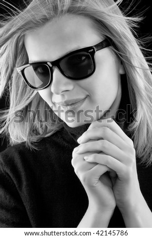 http://image.shutterstock.com/display_pic_with_logo/381634/381634,1259872985,3/stock-photo-beautiful-blonde-girl-in-a-black-turtleneck-with-retro-sunglasses-on-black-background-black-and-42145786.jpg