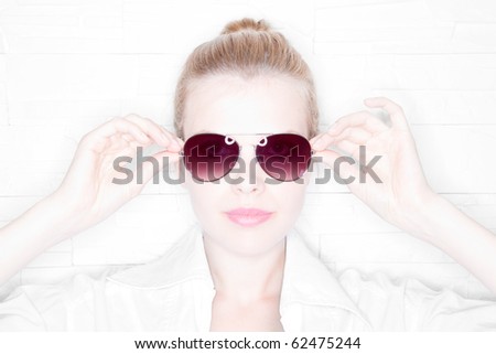 High Key Portrait of a stylish girl with sunglasses