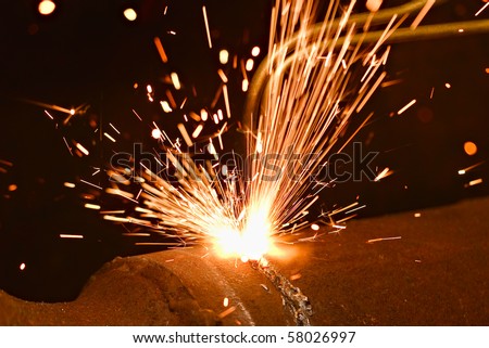 Sparks during cutting of metal by gas welding