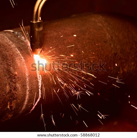 Sparks during the gas cutting of the metal