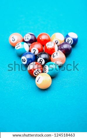 Pool game balls on blue felt table