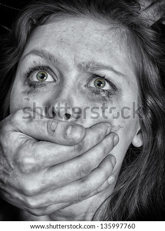 Portrait of scared woman with tears. Violence concept. Black and white