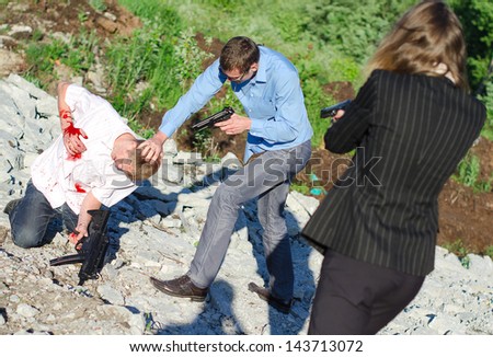 Two FBI agents arresting an offender with knife