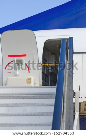 Passenger boarding stairs with open door