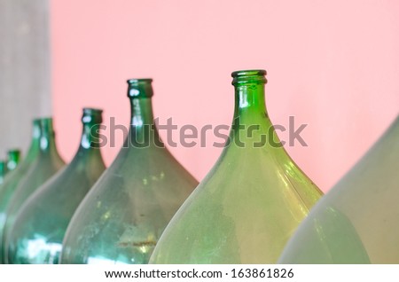 Old green bottles for wine making.