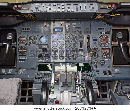 View of aircraft thrust lever in pilot\'s cabin.