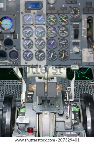 View of aircraft thrust lever in pilot\'s cabin.