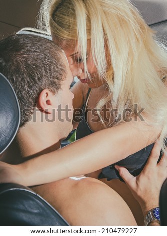 Young couple making love in the car.