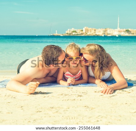Happy family on the beach vacation.
