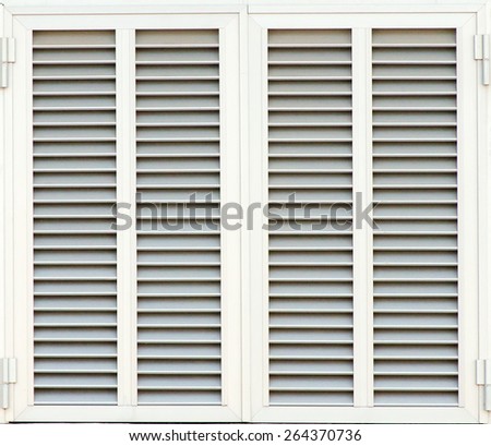 Window with white shutters. Close-up view.