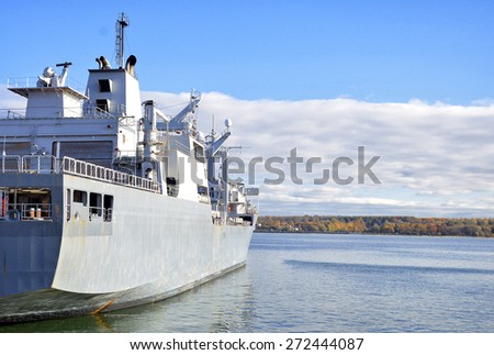 Naval auxiliary ship in the bay.