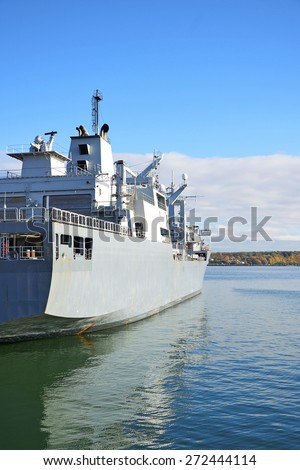Naval auxiliary ship in the bay.