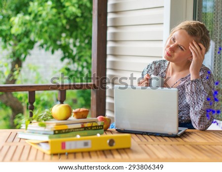 Female writer working on her new book.