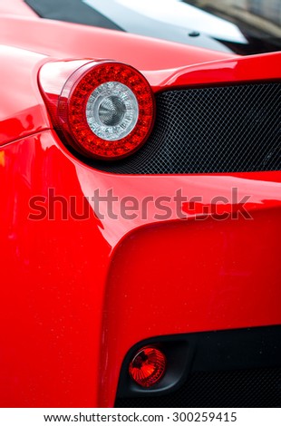 Close-up view of red sports car rear light.