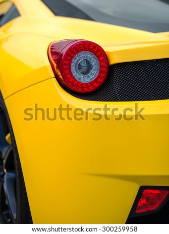 Close-up view of yellow sports car rear light.