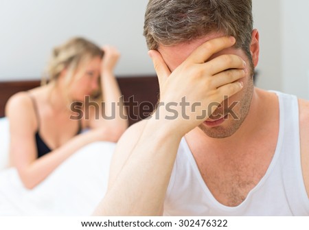 Upset young couple having problems with sex.