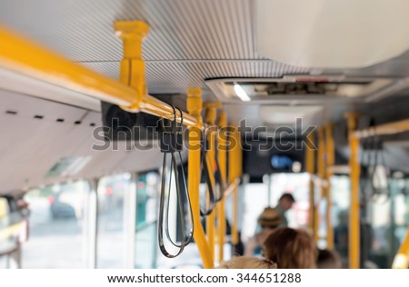 View from inside the city bus with passengers.
