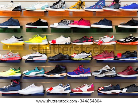 Big collection of different sport shoes.