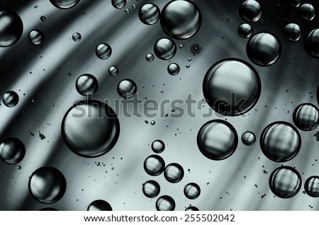 oil drops on the water surface in black white