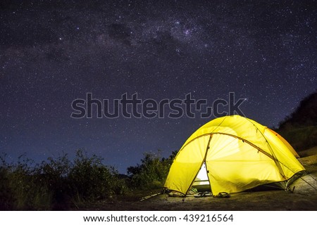 Tent camping under starry night