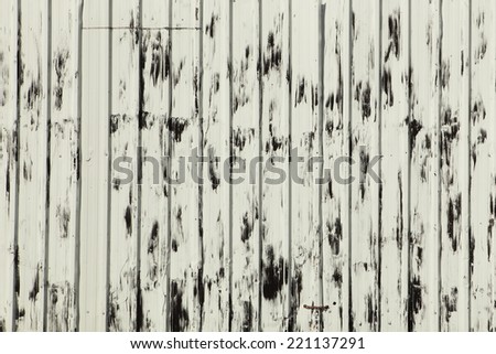 background texture of black and white weathered paint on sheet metal
