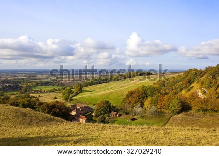 vale of york scenery in agricultural lands under a blue cloudy sky in the yorkshire wolds england in autumn