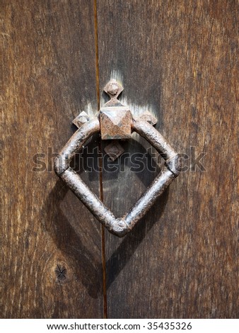 iron door handle on the oak door of an ancient english church
