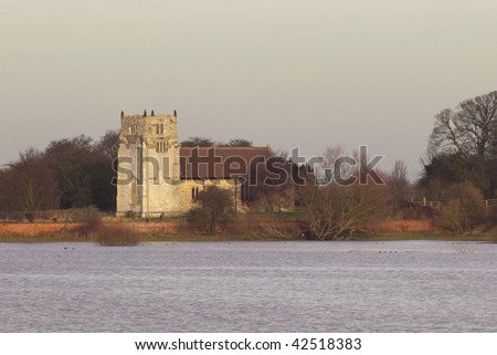 a rural church overlooking winter flood waters