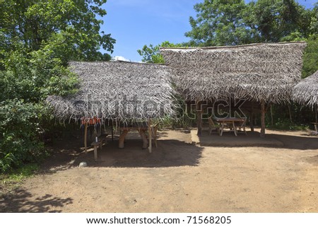 traditional thatched shelters giving welcome shade beneath the trees in sri lanka