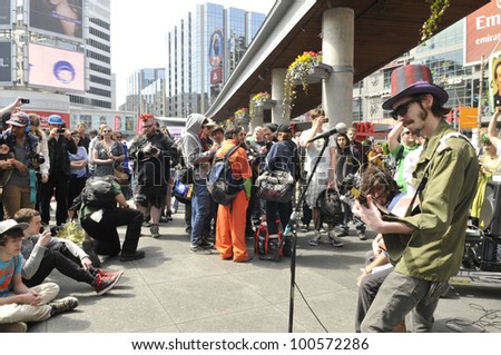 TORONTO - APRIL 20:  Live band performing and entertaining crows during the annual marijuana 420 event at Yonge & Dundas Square  on April 20  2012 in Toronto, Canada.