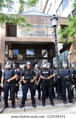 TORONTO-JUNE 28: Toronto police in front of their headquarter during  a rally to protest against the mass G20 arrest on June 28, 2010 in Toronto, Canada.