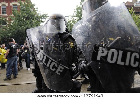 TORONTO-JUNE 26:  Riot police officers standing on queen street during the G20 Protest on June 26 2010 in Toronto, Canada.