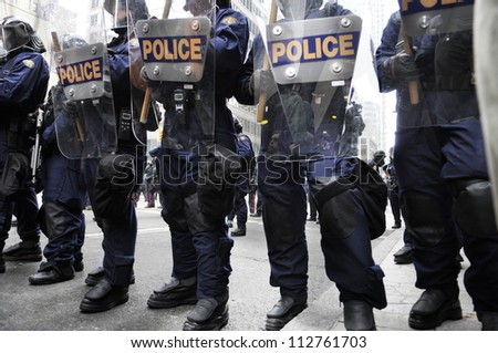 TORONTO-JUNE 26:   Riot police officers with their riot gears during the G20 Protest on June 26 2010 in Toronto, Canada.