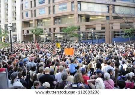 TORONTO-JUNE 28:  Torontonians  gather outside the police headquarters  to protest against the mass arrest a day before during the G20 Protest on June 28, 2010 in Toronto, Canada.