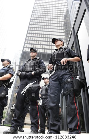 Toronto-June 27: Police Officers Protecting An Important Financial Building During The G20 Protest On June 27, 2010 In Toronto, Canada.