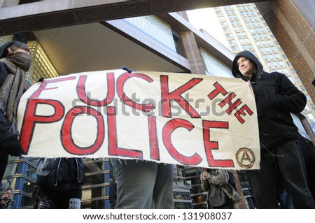 TORONTO-MARCH 15: Unidentified protesters gathered in front the Toronto police Headquarter to celebrate the 17th International Day Against Police Brutality on March 15, 2013 in Toronto, Canada.