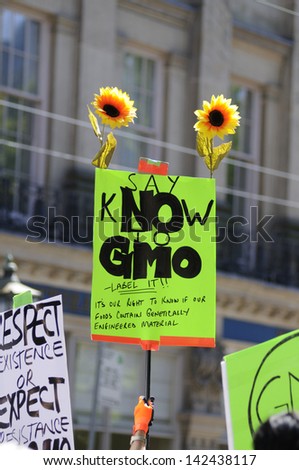 TORONTO-MAY 25: An activist holding a sign asking to say \