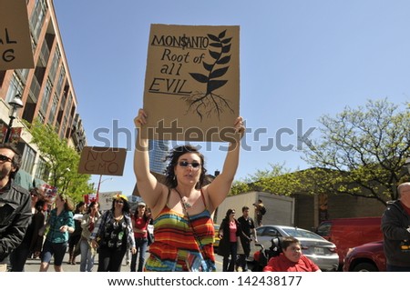 TORONTO-MAY 25: A woman holding a banner saying\