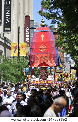TORONTO - JULY 13:  The holy chariot rolling down the Yonge  street during the 41st Annual Festival of India on July 13, 2013 in Toronto-Canada.