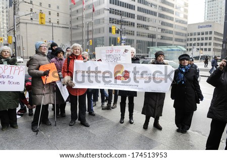 TORONTO-JANUARY 31: People of all ages gathered on Downtown Toronto during a rally to protest the proposed TPP  trade agreement and NAFTA  Agreement on January 31, 2014 in Toronto, Canada.